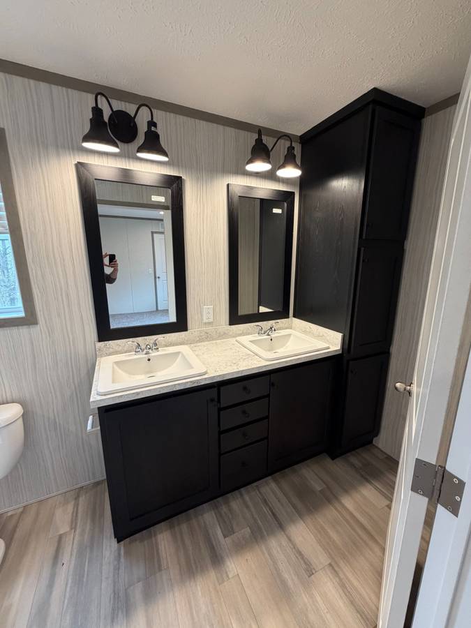 Brand new Manufactured House in a clean, safe, quiet park with large wooded lots.