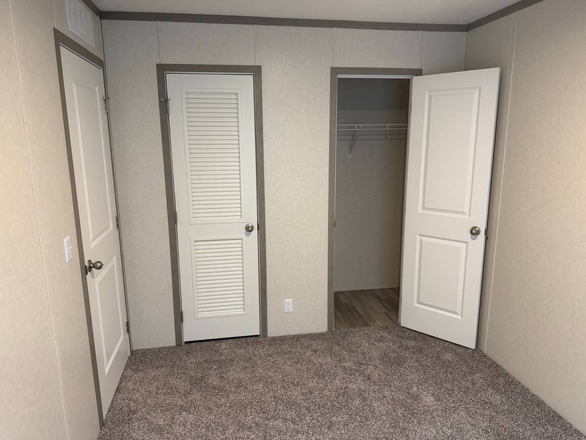 Brand new Manufactured House in a clean, safe, quiet park with large wooded lots.