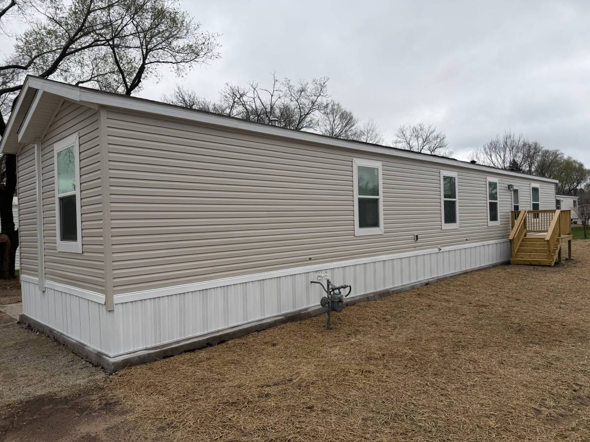 Brand new Manufactured House in a clean, safe, quiet park with large wooded lots.