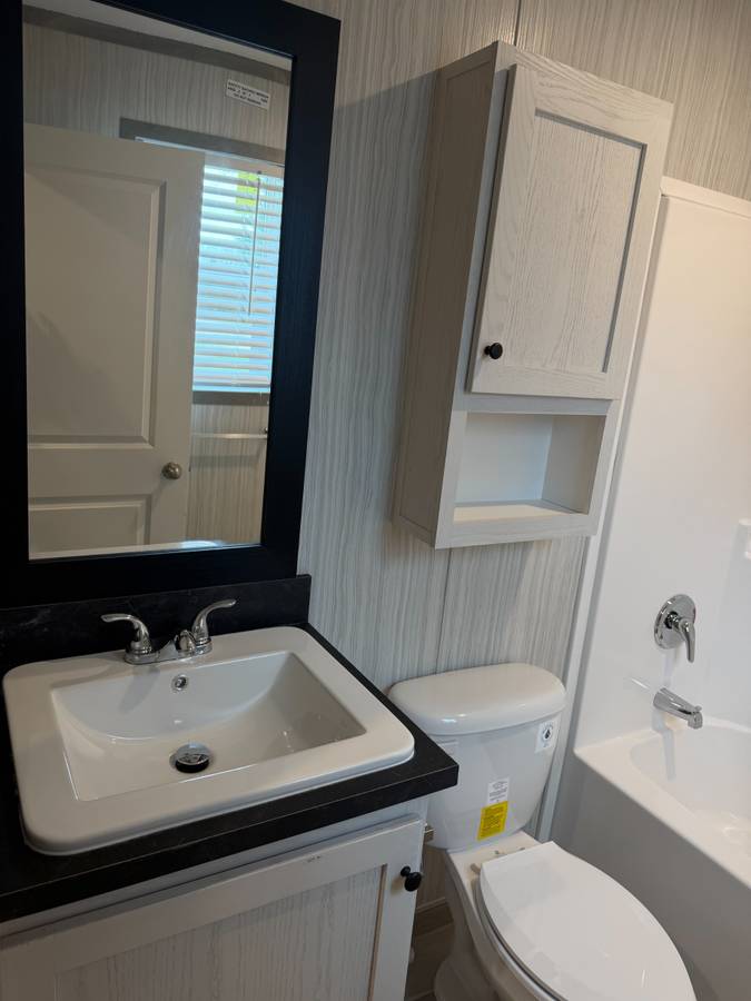 Brand new Manufactured House in a clean, safe, quiet park with large wooded lots.