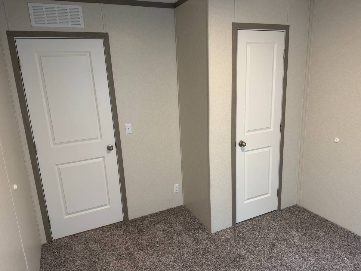 Brand new Manufactured House in a clean, safe, quiet park with large wooded lots.