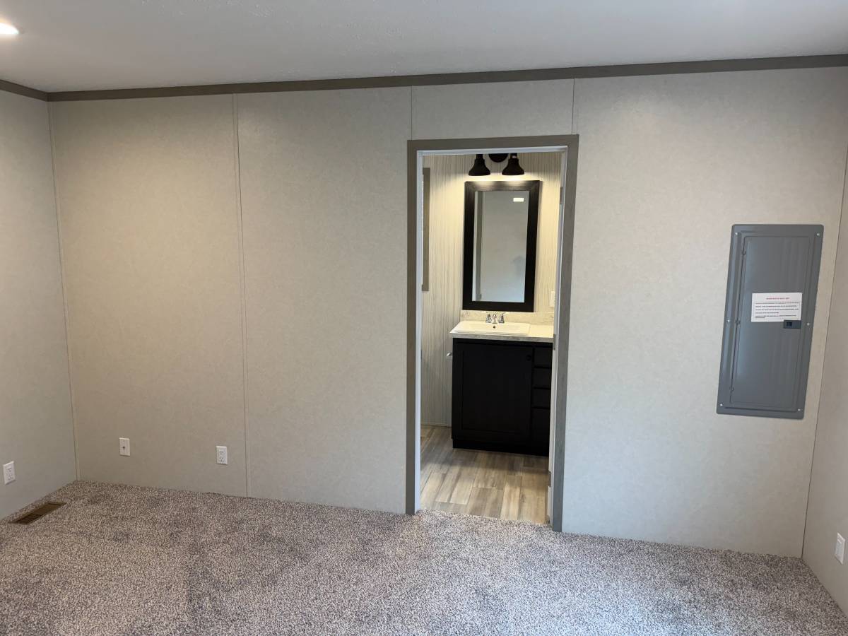 Brand new Manufactured House in a clean, safe, quiet park with large wooded lots.