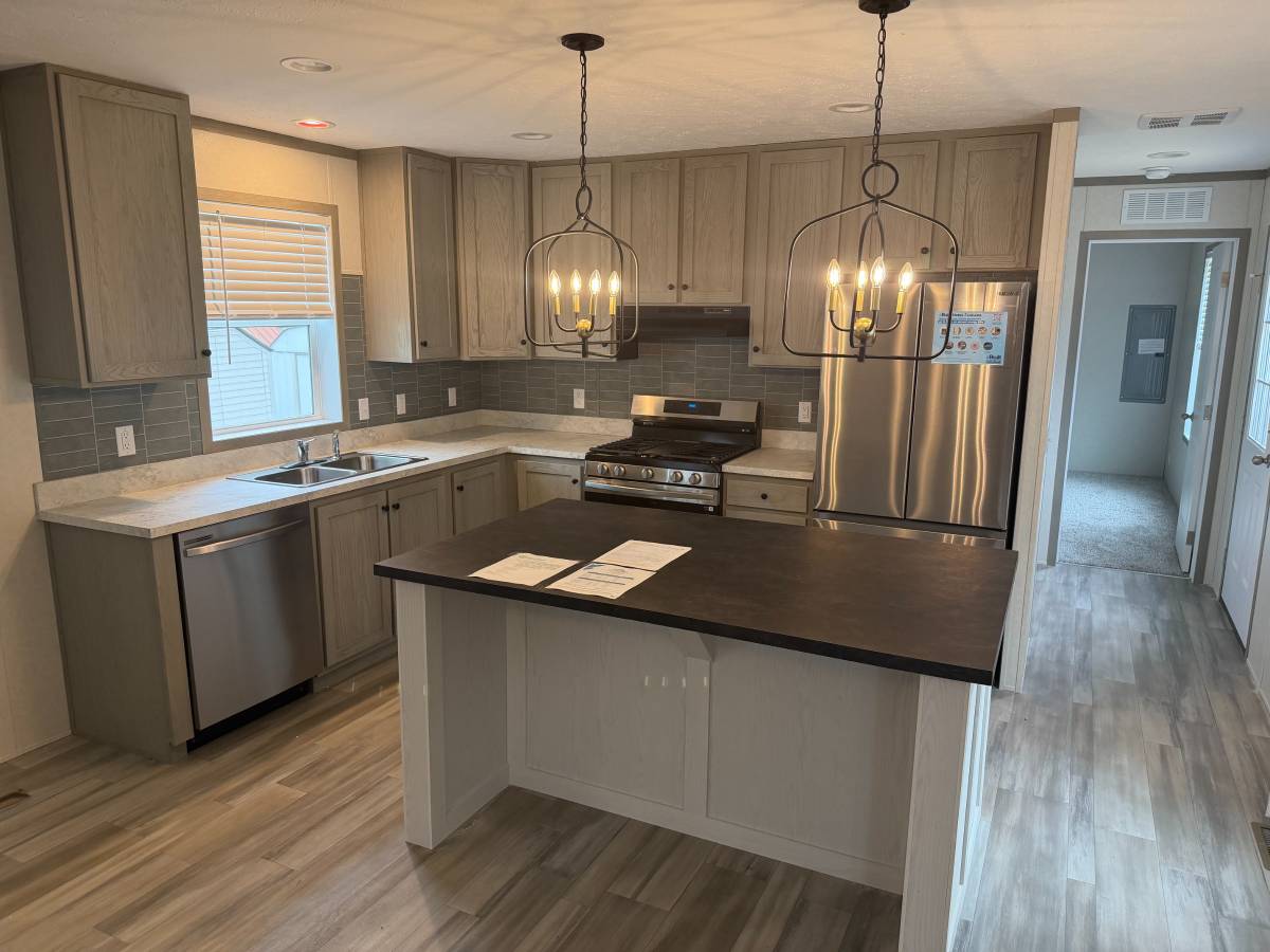 Brand new Manufactured House in a clean, safe, quiet park with large wooded lots.