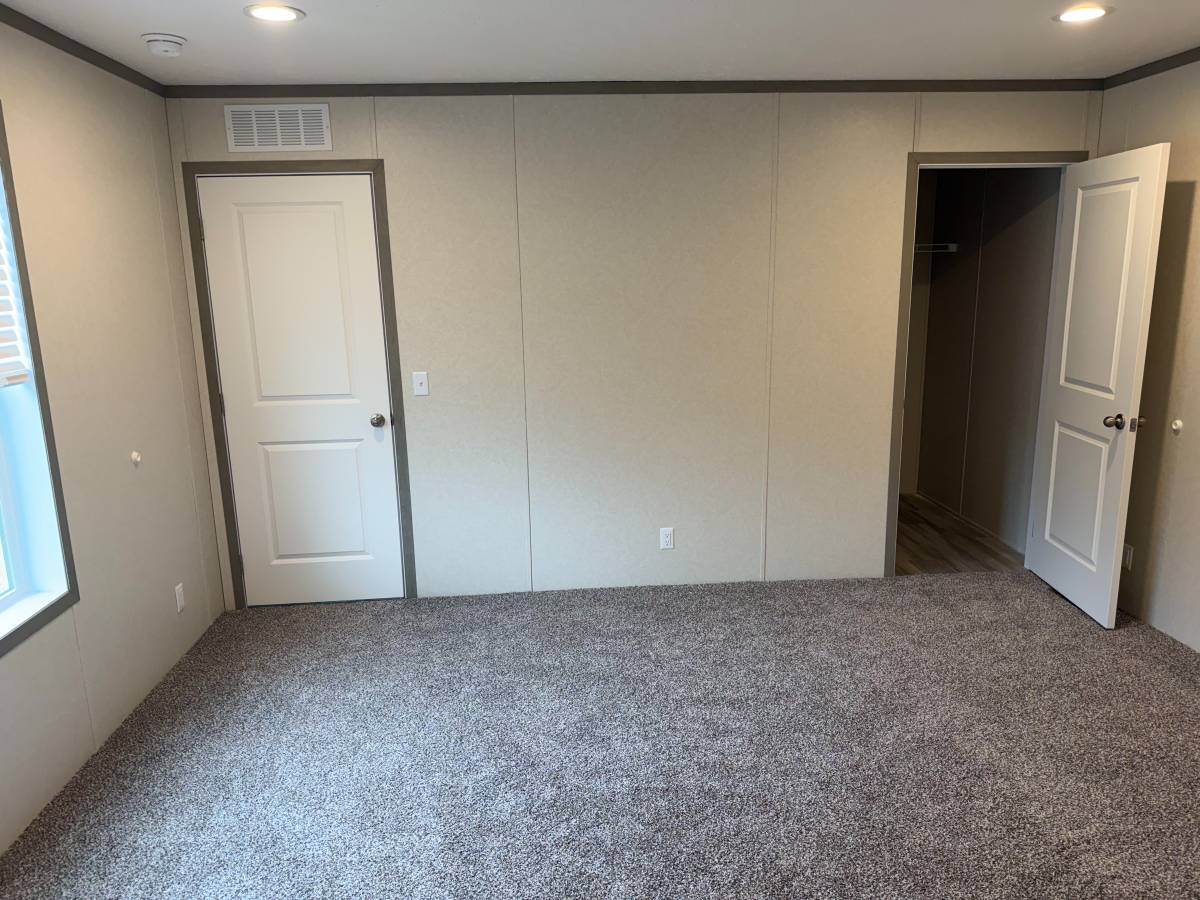 Brand new Manufactured House in a clean, safe, quiet park with large wooded lots.