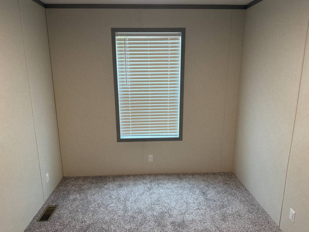 Brand new Manufactured House in a clean, safe, quiet park with large wooded lots.