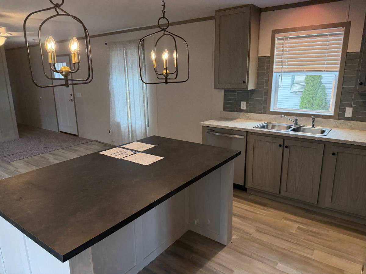 Brand new Manufactured House in a clean, safe, quiet park with large wooded lots.