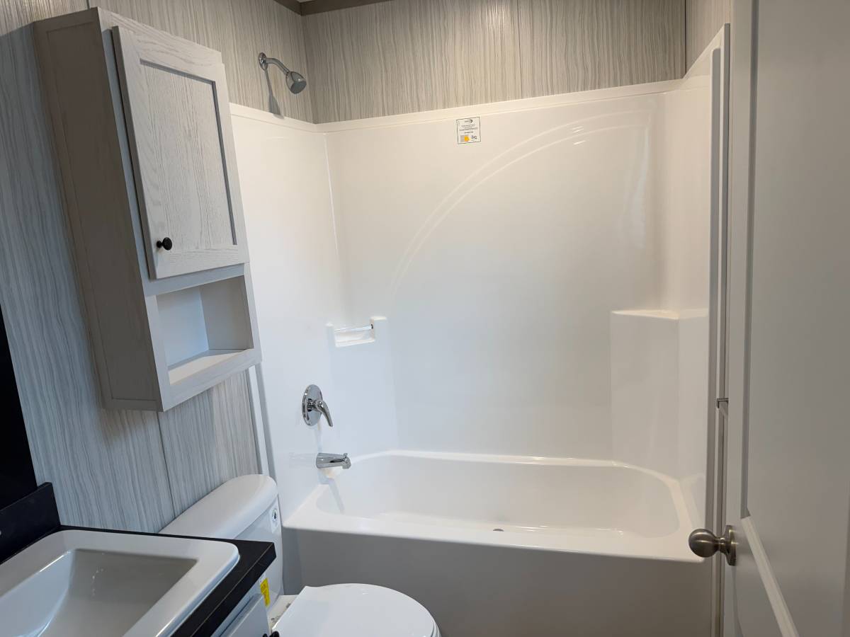 Brand new Manufactured House in a clean, safe, quiet park with large wooded lots.