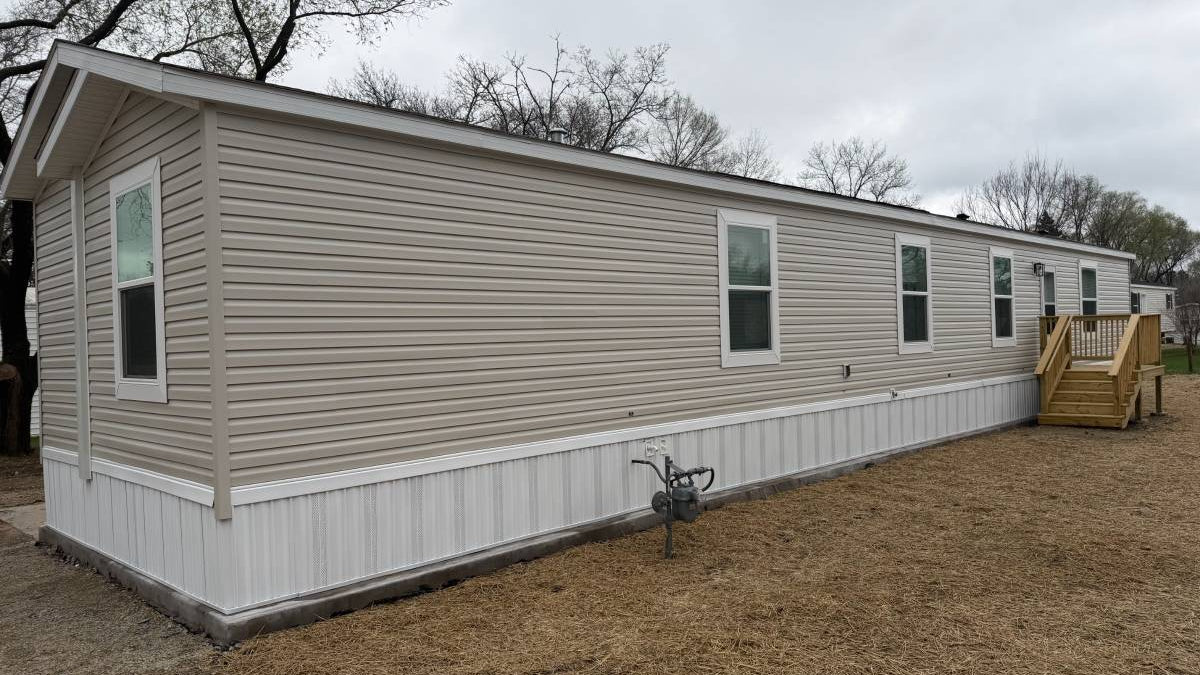 Brand new Manufactured House in a clean, safe, quiet park with large wooded lots.