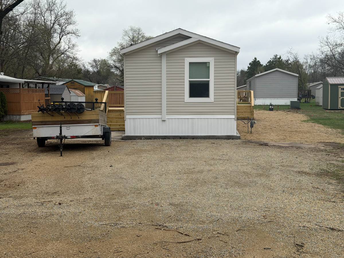 Brand new Manufactured House in a clean, safe, quiet park with large wooded lots.